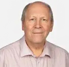 Headshot of Andrew Warmington.