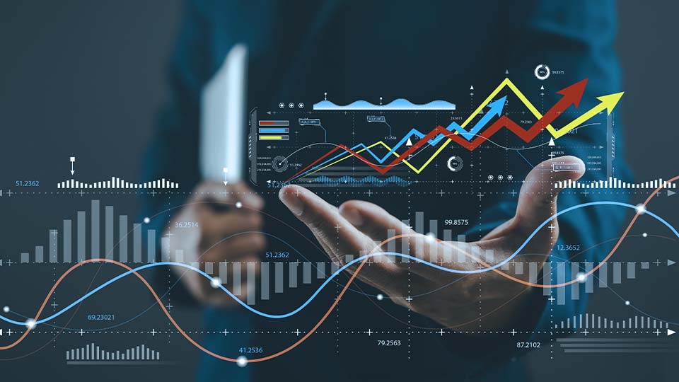 Business professional with their hand out amongst floating, digital graphs and charts.