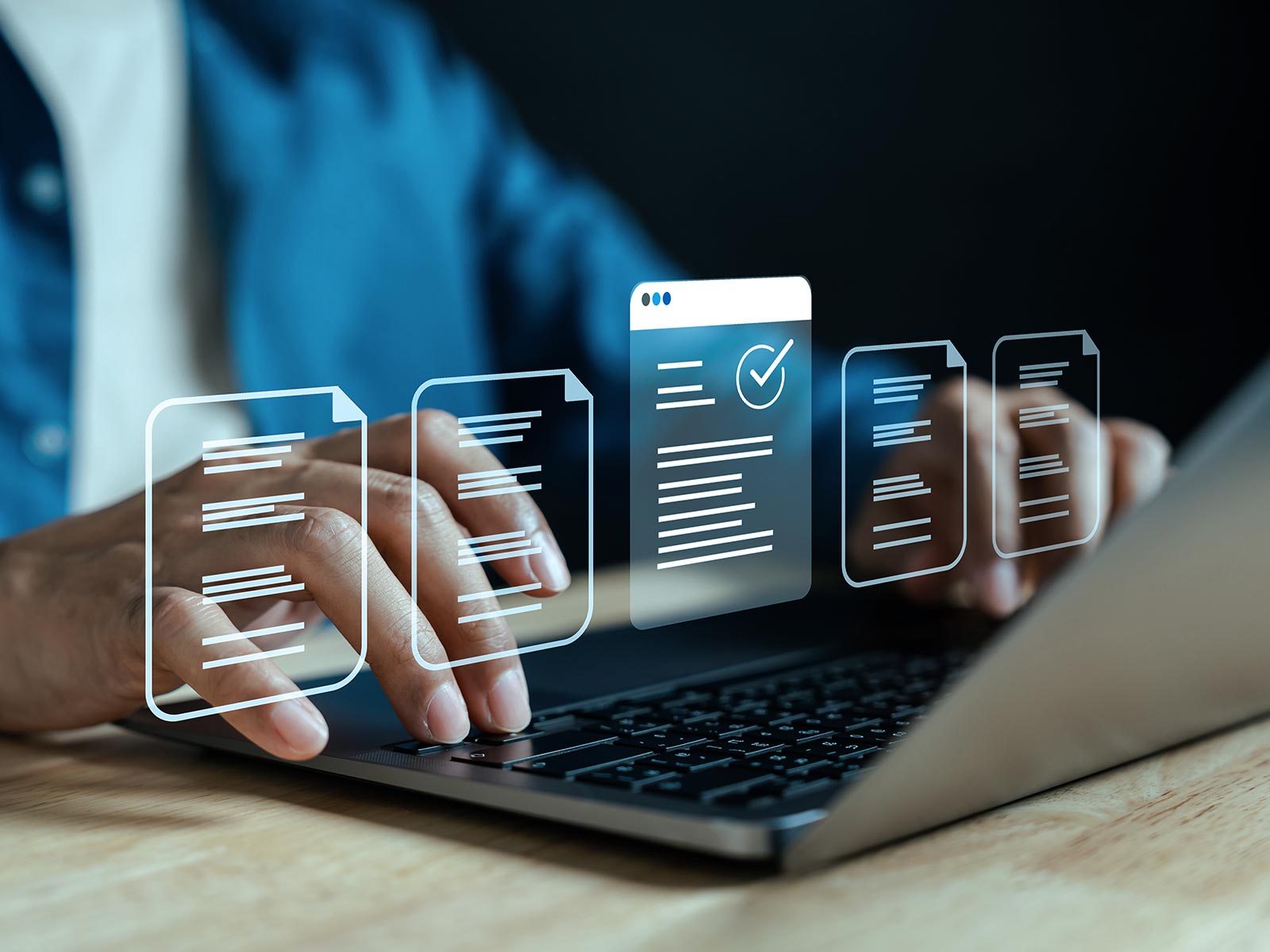 Hands typing on a laptop with digital document icons and a checklist overlay, symbolizing online document management.