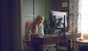 Madeline Naylor sitting in her home office.
